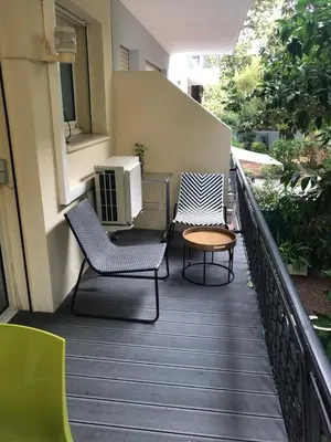 two chairs and a table on a balcony at Appart 2 pièces Cannes Croisette-Martinez in Cannes