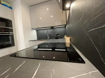 a kitchen with a black counter top and a sink at Grand Palais ANT1308 in Cannes