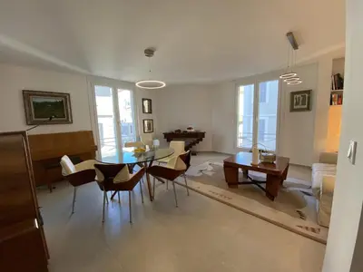 a living room with a table and chairs and a couch at Grand Palais ANT1308 in Cannes