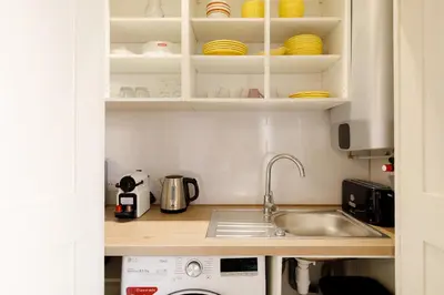 a kitchen with a sink and a dishwasher at Panisse YourHostHelper in Cannes
