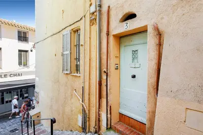 a door on the side of a building at Panisse YourHostHelper in Cannes