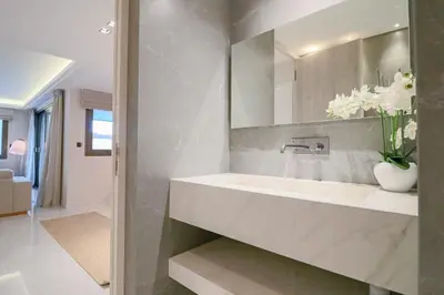 a bathroom with a sink and a mirror at GRAY Renovated luxurious apartment located in Cannes in Cannes