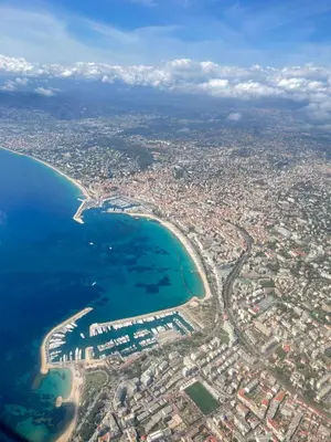 an aerial view of a city and the ocean at Appartement WHITE DESIGN Proche Cannes in Le Cannet