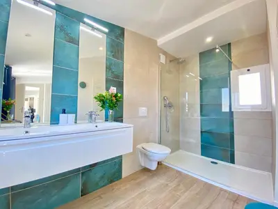 a bathroom with a sink and a toilet and a shower at Duplex Luxury Toîts du Soleil By SCLS Locations in Cannes