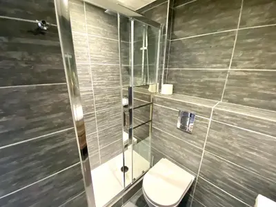a bathroom with a toilet and a shower at Le Marignan By SCLS Locations in Cannes