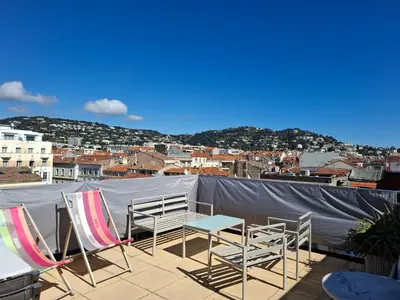 a group of chairs and tables on a roof at Macé9 in Cannes