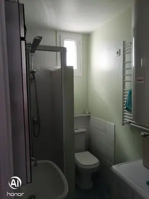 a small bathroom with a toilet and a sink at Macé9 in Cannes