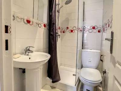 a bathroom with a sink and a toilet and a shower at Studio Carré d'Or. 2 mins from the Croisette. 143 in Cannes
