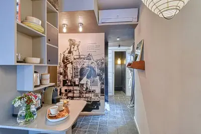 a hallway of a kitchen with a wall mural at C074-Cannes Studio - Cannes Forville in Cannes
