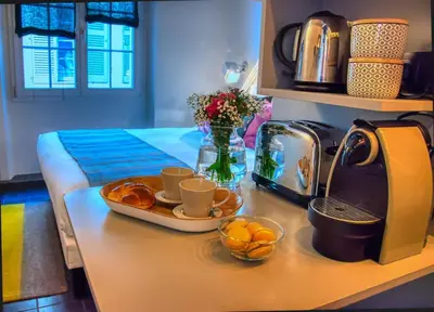 a kitchen counter with a tray of oranges and coffee cups at C074-Cannes Studio - Cannes Forville in Cannes
