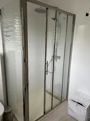 a shower with a glass door in a bathroom at Bella vista luxe 2 chambres in Cannes