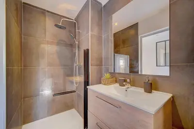a bathroom with a shower and a sink at Le Max et Leo - 600m plage - Verrière côte d'Azur in Cannes
