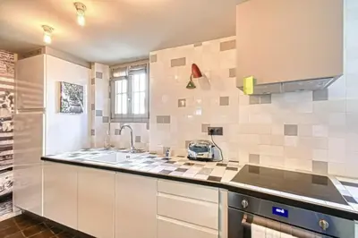 a kitchen with a sink and a counter top at C075-Old Town Cannes - Duplex Apartment in Cannes