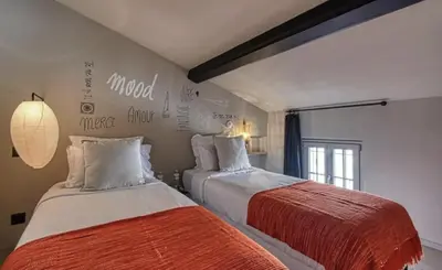 two beds in a room with at C075-Old Town Cannes - Duplex Apartment in Cannes