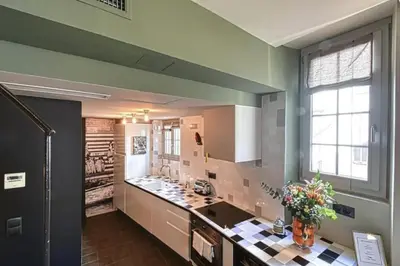 a kitchen with a sink and a counter top at C075-Old Town Cannes - Duplex Apartment in Cannes