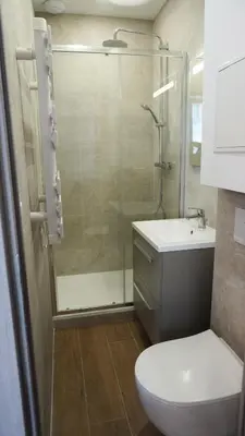 a bathroom with a shower and a toilet and a sink at Proche Carlton & Croisette, Appartement 203 - Palmazur Vacances in Cannes