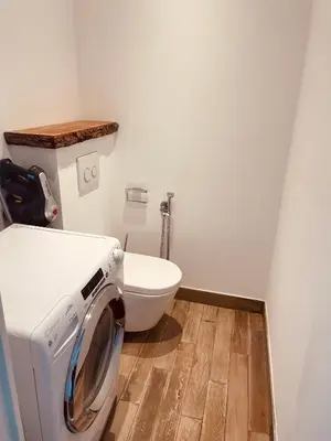 a washing machine in a bathroom with a toilet at superbe appartement centre Cannes in Cannes