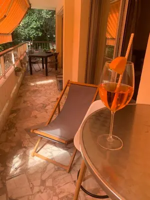 a glass of wine sitting on top of a table at Appart Le Cannet in Le Cannet