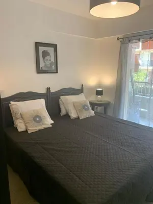 a bedroom with a bed with two pillows on it at Appart Le Cannet in Le Cannet