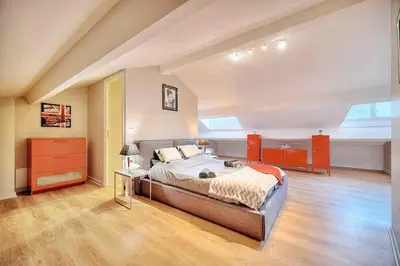 a bedroom with a large bed in a room at CROISETTE 8/10 pers in Cannes