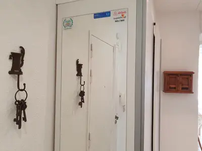 a door in a room with some weapons on the wall at Suquet 22 – 2 Pièces, Cannes Cœur Historique, Calme, Plage à 300m, Parking in Cannes