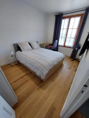 a bedroom with a bed and a wooden floor at Cannes centre, super cosy apartment near everything in Cannes