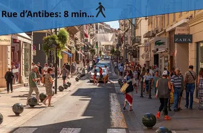 a crowd of people walking down a busy city street at Cannes centre, super cosy apartment near everything in Cannes