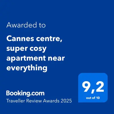 a screenshot of a phone with the text awarded to games centre super cozy apartment at Cannes centre, super cosy apartment near everything in Cannes