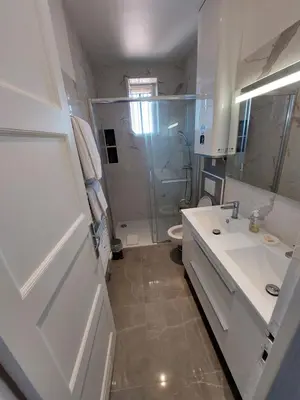 a bathroom with a shower and a sink and a toilet at Cannes centre, super cosy apartment near everything in Cannes