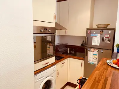 a kitchen with a refrigerator and a dishwasher at MON2-Studio spacieux Cannes centre in Cannes