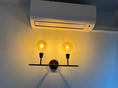 a shelf with two lights on a wall at Superbe appartement une chambre vue mer piscine tennis in Cannes