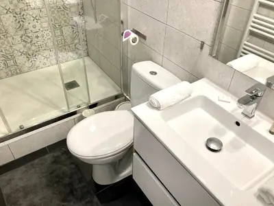 a bathroom with a toilet and a sink and a shower at Cannes: superbe studio x3 personnes, top position! in Cannes