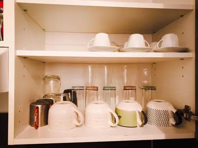 a shelf with many glass jars and utensils at L'étoile pétillante in Cannes