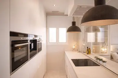 a white bathroom with a sink and a shower at 