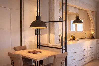 a bathroom with a tub and a sink and a mirror at 
