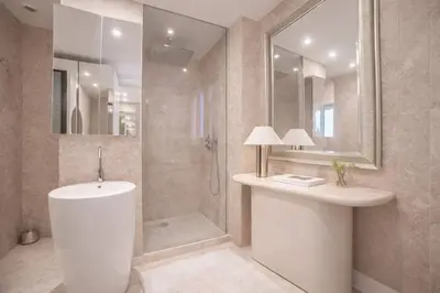 a white room with a bed and a tv at 
