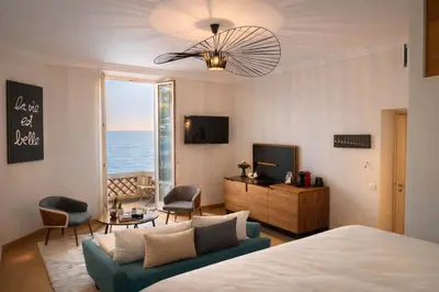 a bedroom with a bed and a blue couch at 