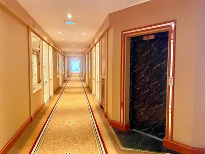 a hallway of a building with a long corridor at Croisette Beach & Palace in Cannes