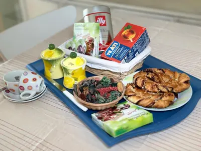 a blue tray with food on top of a table at Maison de ville tout confort à Cannes et à 10 Minutes à pied de la plage in Cannes