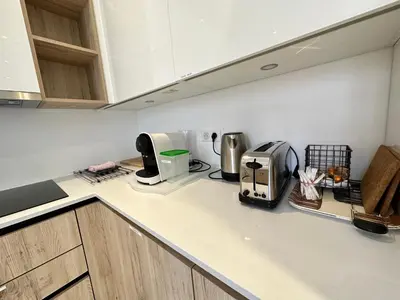 a kitchen counter with a toaster and a coffee maker at Maison de ville tout confort à Cannes et à 10 Minutes à pied de la plage in Cannes