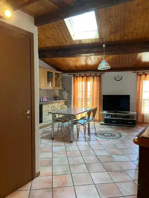 a kitchen with a table and chairs in a room at Le Suquet Appart in Cannes