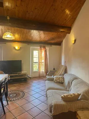 a living room with a couch and a flat screen tv at Le Suquet Appart in Cannes