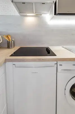 a kitchen with a stove top on a counter at S 2P CANNES AS - Le Marie Antoinette in Cannes
