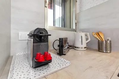 a kitchen counter with a toaster and a coffee maker at S 2P CANNES AS - Le Marie Antoinette in Cannes