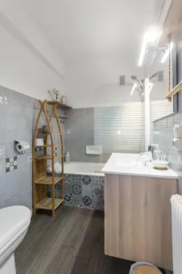 a bathroom with a tub and a sink and a toilet at S 2P CANNES AS - Le Marie Antoinette in Cannes