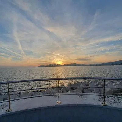 a boat in the water with the sunset in the background at S 2P CANNES AS - Le Marie Antoinette in Cannes