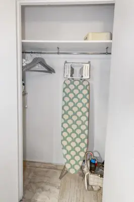 a tie hanging on a rod in a closet at S 2P CANNES AS - Le Marie Antoinette in Cannes