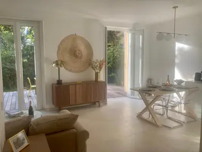 a living room with a couch and a table at Cannes - L'Oustaou in Cannes