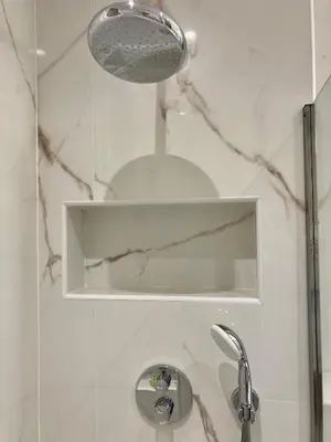 a white bathroom with a shower with a sink at Cannes - L'Oustaou in Cannes