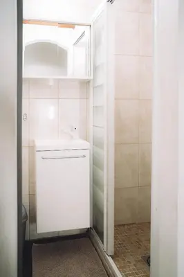 a small bathroom with a sink and a toilet at CANNES CENTRE VILLE- Bel appartement studio + Mezzanine in Cannes